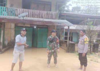 Polsek Hulu Kuantan Lakukan Patroli dan Monitor Banjir Akibat Luapan Sungai Ulo